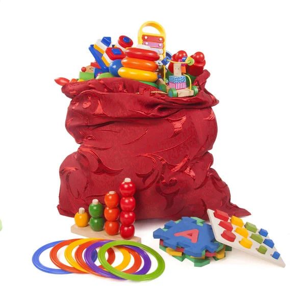 Saco vermelho grande com muitos brinquedos — Fotografia de Stock