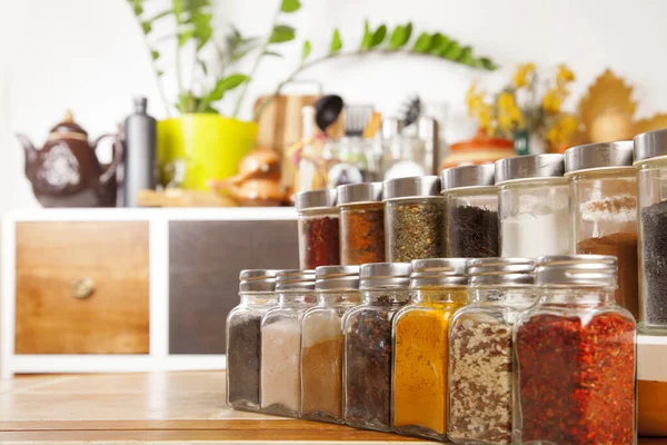 Jars of spices on the table in the kitchen