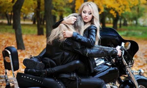 Couple on a motorcycle in a leather jackets — Stock Photo, Image