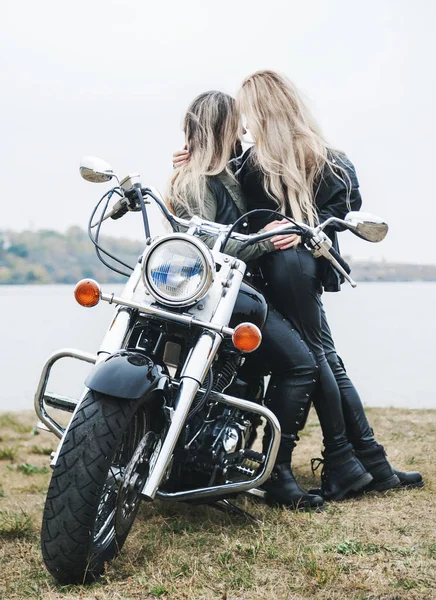 Couple on a motorcycle in a leather jackets