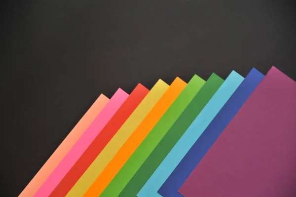 Colorful paper on black background