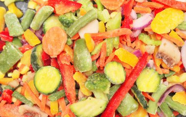 Sağlıklı yemek dokusu. Donmuş sebzeler. Havuç, brokoli, domates, soğan.