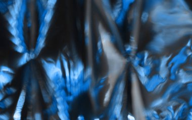 Bulanık holografik folyo dokusunun mavi renkli fotoğrafı. 2020 Yılı Rengi.