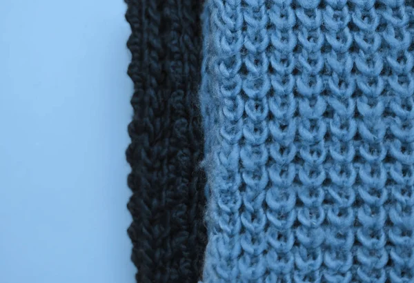 Texture of knitting sweater in blue color.