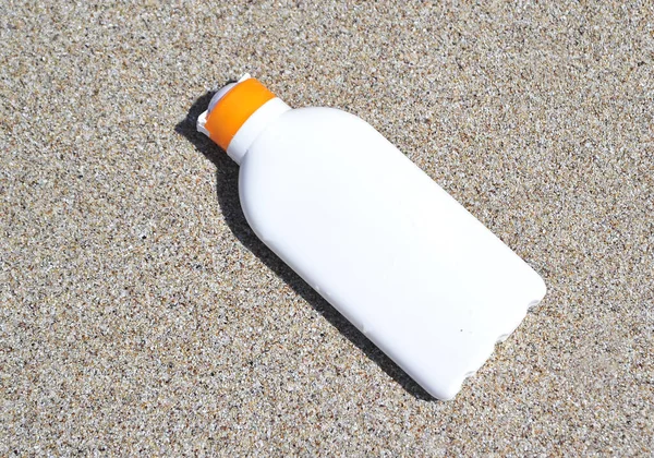 Bottle Sun Protection Cream Sand Texture — Stock Photo, Image