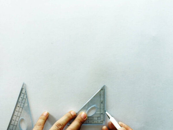 The white office desk with school supplies on top