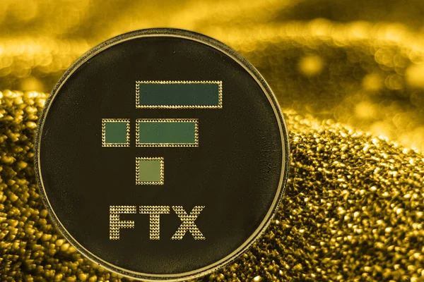 Криптовалюта ftx token на золотому тлі. Ліцензійні Стокові Зображення
