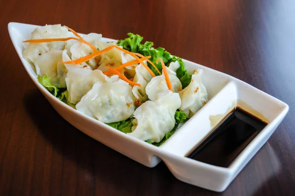 Veggie Potstickers, steamed vegetable dumplings with sweet soy sauce