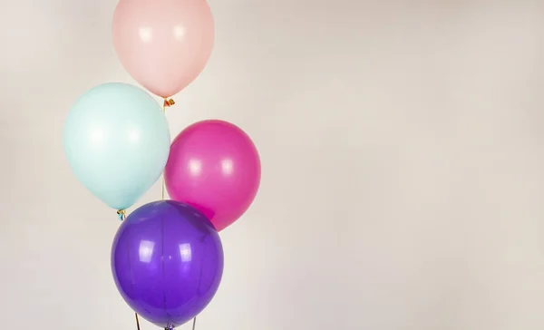 Festive balloons. Balloon on a light background. Happy birthday concept. Birthday with festive multi-colored balloons. Celebrate your birthday poster. Banner. Copyspace