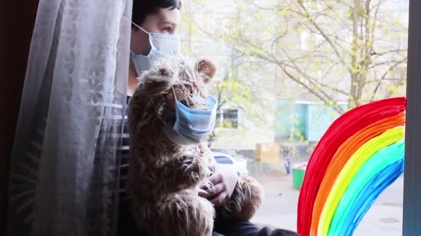 Boy Sitting Window Boy Adjusts Mask Bear — Stock Video