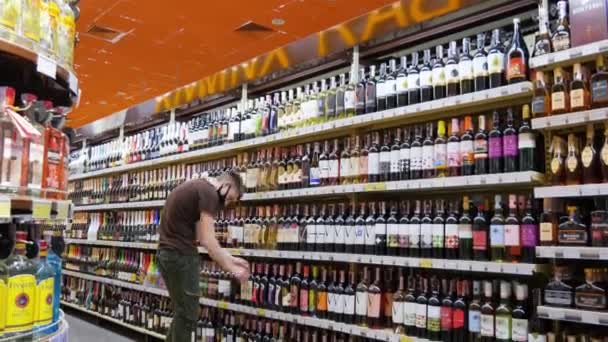 Liquor Store Guy Straightens Bottles Alcoholic Drinks — Stock Video