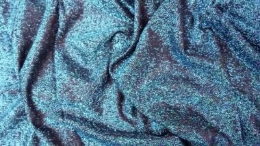 Lurex geçmişi. Yeşil arka planda parlayan Noel.