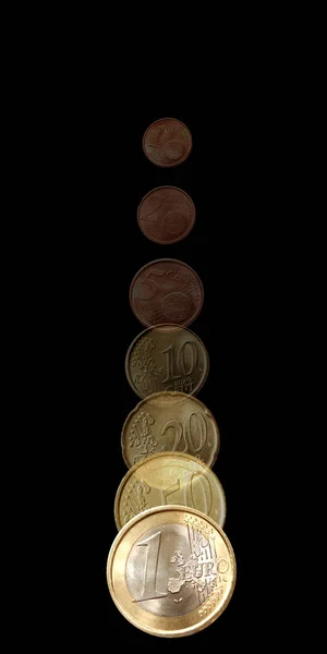 Falling coins on black background — Stock Photo, Image