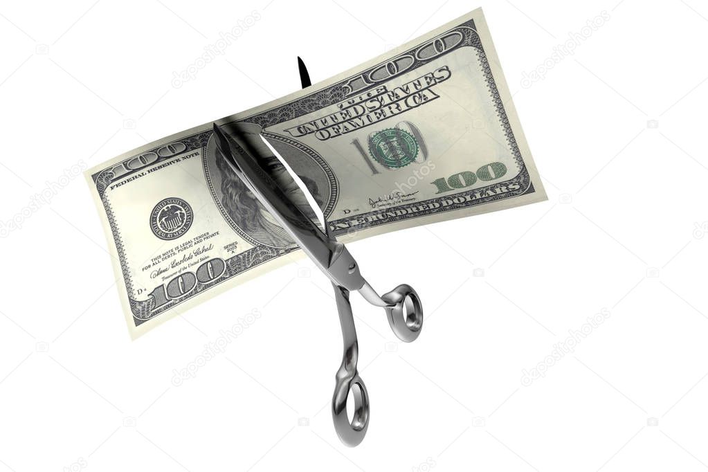 Scissors cutting a 100 dollars banknote