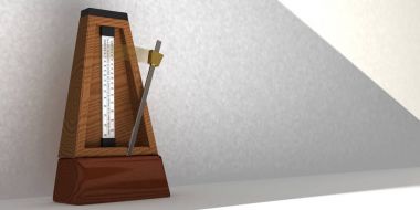 Wooden metronome with pendulum in motion clipart