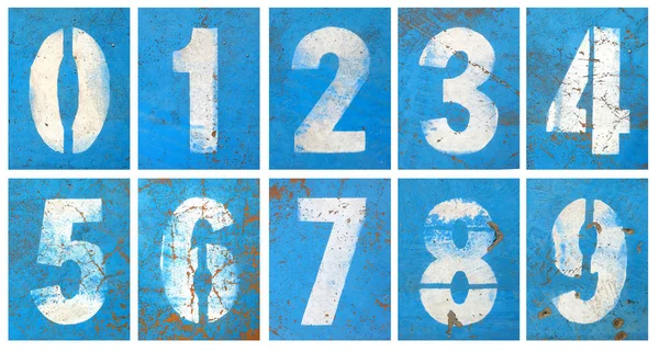 Números série em uma parede azul — Fotografia de Stock