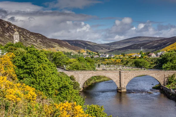 Bridge over Helmsdale River with town.