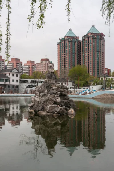 Tuanjiehu Park pond with high rises, Beijing. — Stock Photo, Image