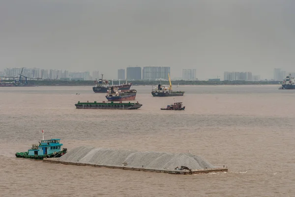 Barge with stones is pushed on Long Tau River, Ho Chi Minh City, — Stock Photo, Image