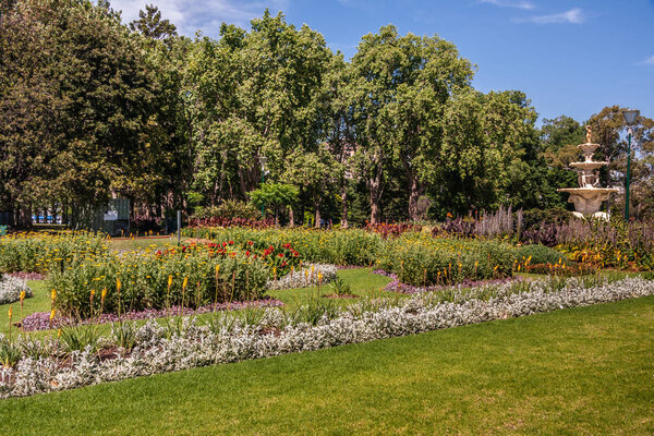 Pagoda style fountain hidden in green of Carlton Gardens, Melbou