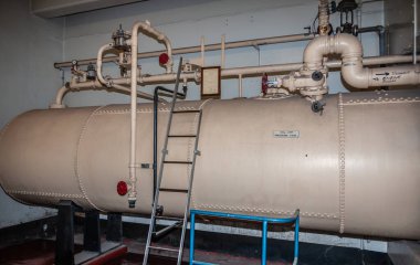 Brisbane, Australia - December 8, 2009: Castlemaine Perkins brewery. Closeup of large beige tank filled with CO2, ingredient in beer.