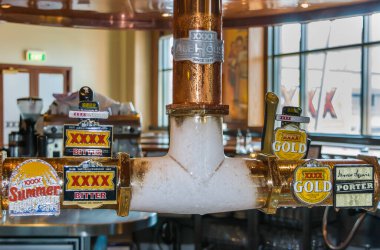 Brisbane, Australia - December 8, 2009: Castlemaine Perkins brewery. The bar of visitor centre has ice covered copper tap installation for 4 locally brewed beers.
