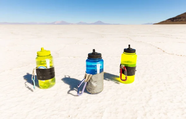 Three plastic drinking bottles, Salar De Uyuni desert Bolivia.