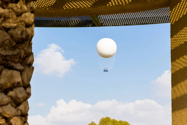 Hot air balloon soaring sky window view. — Stock Photo, Image