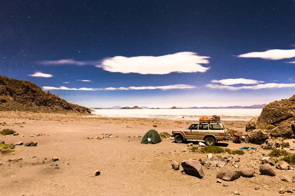 Night camp stars Salar De Uyuni salt desert Bolivia.