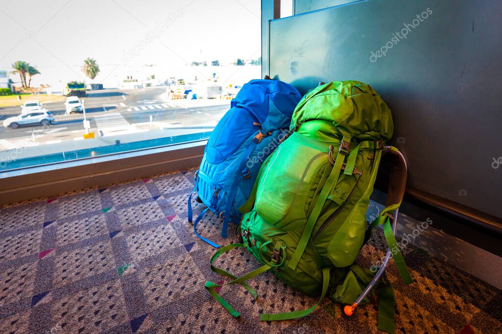 Two backpacks bags without people, couple traveling love relationship tourism togetherness concept.