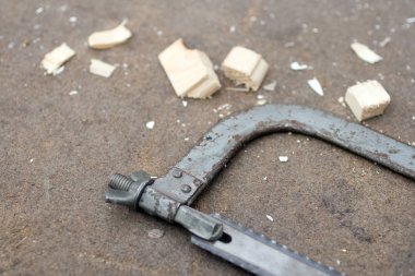 Hacksaw for metal on a carpentry table