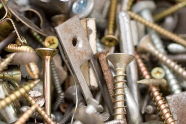 Rusty nails and tapping screws in a bucket