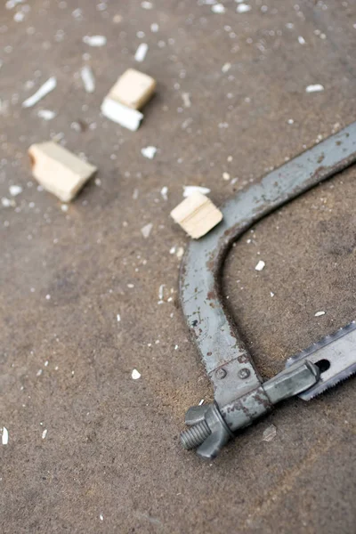 Hacksaw for metal on a carpentry table