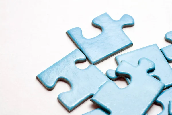 Blue puzzle pieces on white background — 스톡 사진