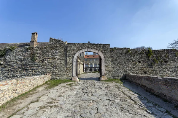 The gate of the Tata castle on a sunny spring day.