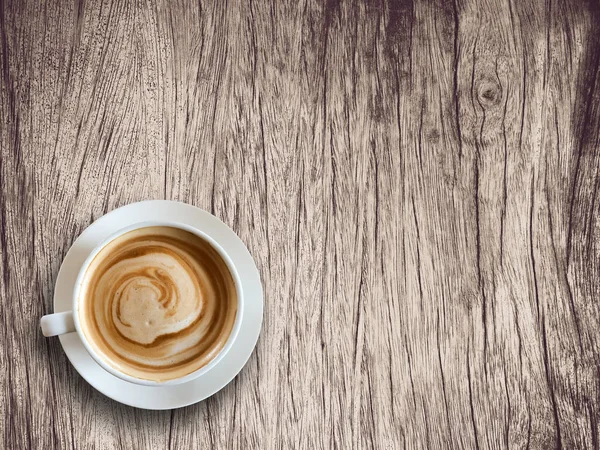 Tasse à café sur fond en bois texturé . — Photo