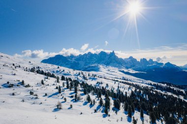 Sunny winter landscape at Ski Area in Dolomites, Italy - Alpe Lusia. Ski resort in val di Fassa near Moena clipart