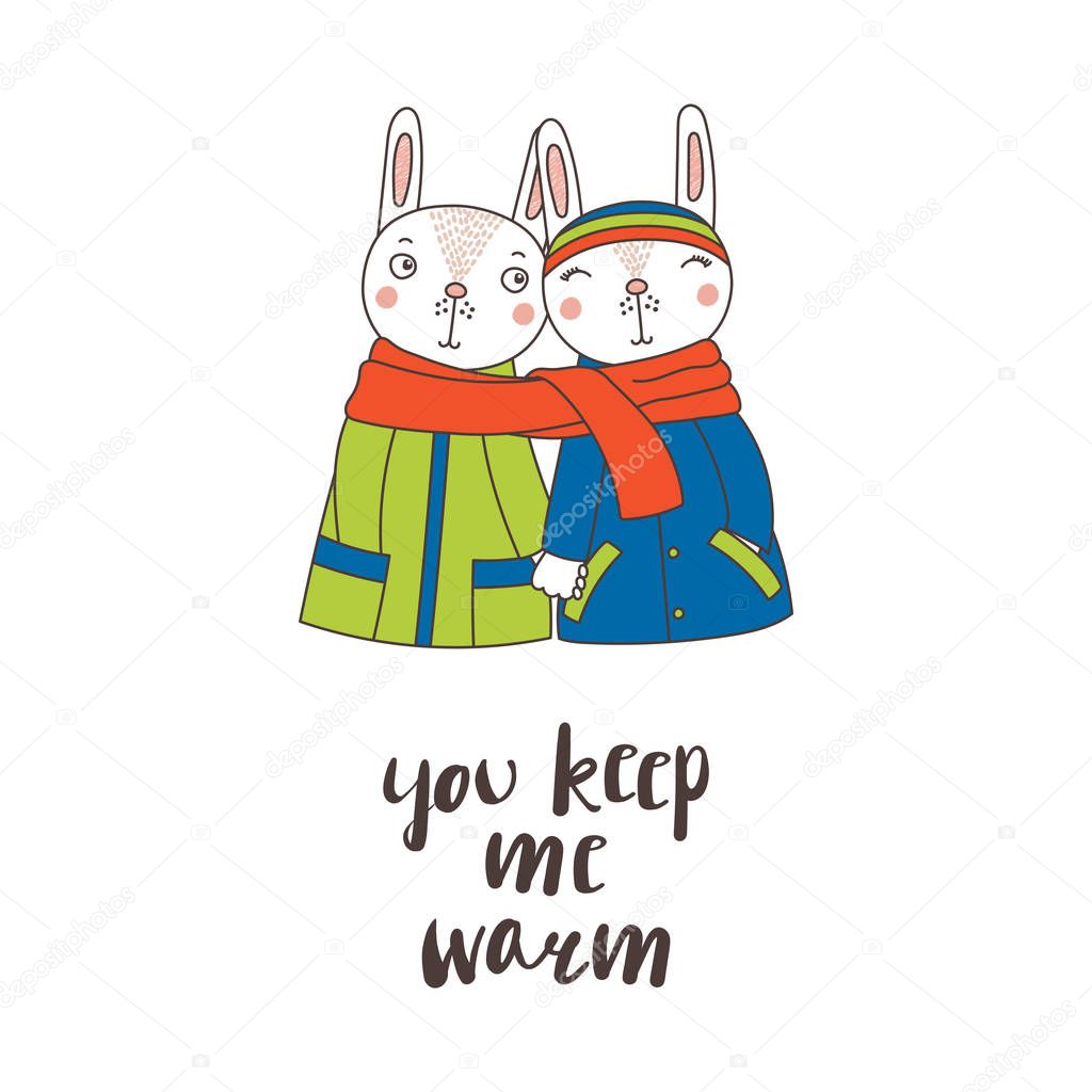 A couple of rabbits wrapped in one scarf