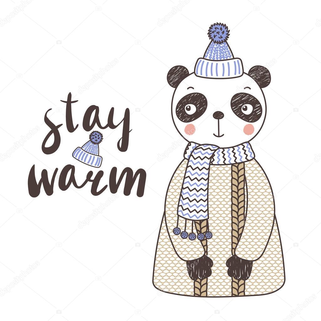 Cute funny panda in a knitted hat and sweater