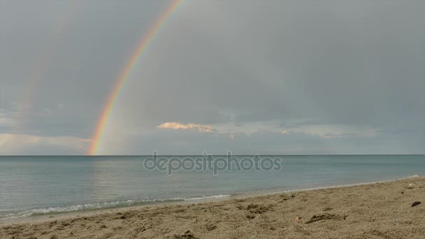 Rainbow and sea, view from beach — Stock Video