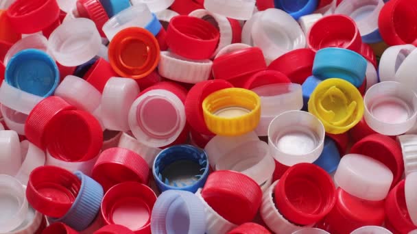 Heap Colorful Plastic Bottle Caps Recycling Panning Footage — Stock Video