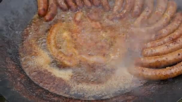 Cook Hand Put Pork Sausage Pan Roasting Fat Handheld Footage — Stock Video