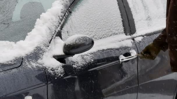 Male Driver Unlock Opening Door And Entering To Car Under Snow With Snowflakes