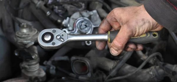 Socket wrench tool in mechanic hand — Stock Photo, Image