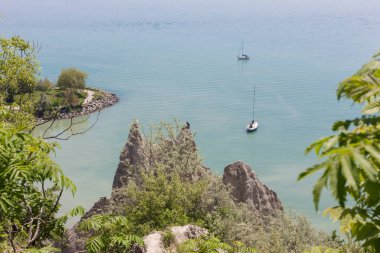 scenic view of sail boats in a bay at Scarborough Bluffs in Toro clipart