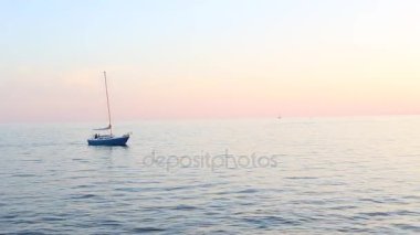 Toronto, ON, Canada - September 23, 2017 - short video of sunset on Lake Ontario with sailboat speedboats and jetskies