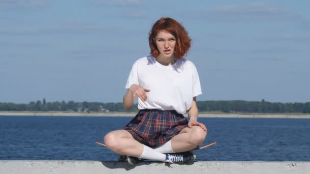 Young ginger girl showing, call me sign. — Stock Video