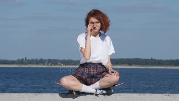 Young ginger girl showing, you call me sign. — Stock Video