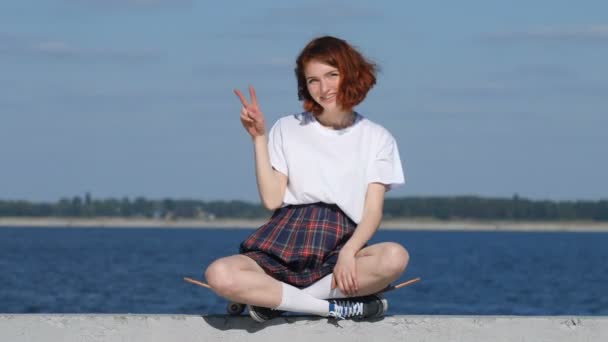 Young ginger girl showing peace sign — Stock Video