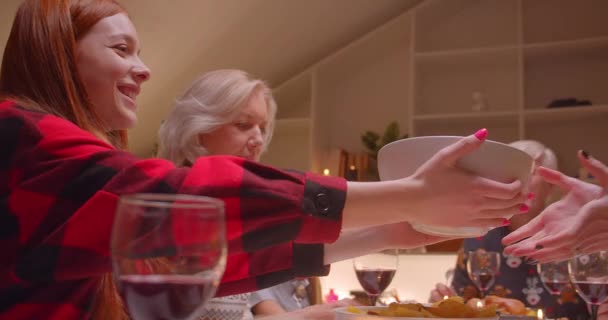 Christmas dinner family reunion evening comfort dialogue grandmother grandfather parents granddaughters gifts laughter — Stockvideo